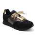 Lola Ramonan mustat ja kullanhohtoiset sneakerit. Malli Goldensplash.
